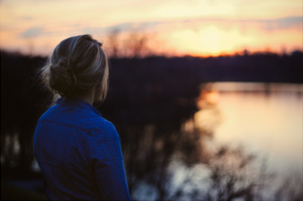 Woman looking over lake | Adult Therapy Services